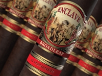 Pictured is a cigar with a band that has a horse and an indian on it, also has a red and gold band under it