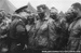 Photo of General Dwight D. Eisenhower meeting with paratroopers of the 101st Airborne Division the day before the D-Day invasion.