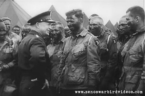 Photo of General Dwight D. Eisenhower meeting with paratroopers of the 101st Airborne Division the day before the D-Day invasion.