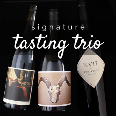 Three 750ml bottles of red wine for $98 on the Signature Tasting Trio including Jolie-Laide, Disciples by The Crane Assembly, and NV17 by Cain Vineyards