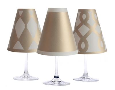 Set of 6 coordinating drum, scroll and solid pattern translucent paper white wine glass shades.  Available in silver and gold.  Made in the USA.
