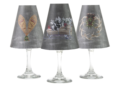 Set of 6 coordinating sleigh, snowshoes, and wreath pattern translucent paper white wine glass shades by di Potter.  Made in the USA