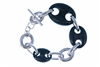 The classic Chain link Bracelet has been updated with hand carved pieces of multi-sized Black Ebony links added to the design. 925 Sterling Silver with Toggle Clasp. Made in Italy by Claudio Faccin