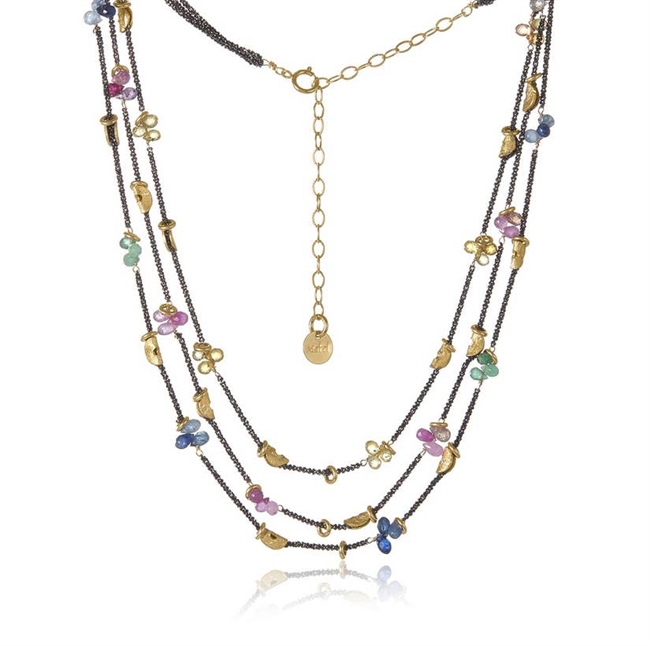 Petal-shaped multi-colored Sapphire and Emerald tear drop Gemstone clusters on three strands of Oxidized diamond cut Sterling Silver chain with 14k gold-plated half moon details. 16"-18" adjustable. Made in San Francisco by Mabel Chong.