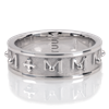 Tuum's Decem Infinity Ring represents their innovative interpretation of the rosary ring. It has 10 raised and beaded M's circling around the ring, representing the Ave Maria, that are spaced by a single cross. White Rhodium Plated Sterling Silver