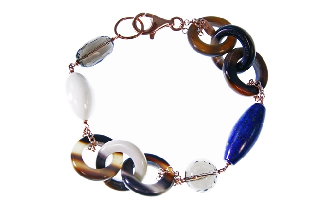 Natural Brown Horn link Bracelet with random accents of Blue Lapis, Smokey Quartz & White Agate Gemstones. The links are held together with Rose Gold plated 925 Sterling Silver Chain links. 8" in length. Lobster Clasp. Made in Italy by Amle