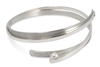 Try this twisted Sterling Silver Cuff Bracelet for a fun, contemporary look. Two solid Bands of Sterling wrap around each other and hold a single Grey 6mm Pearl at one end. Rhodium plated. By designer Martha Seely