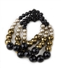 Faceted Black Onyx Gemstones alternate with Bronze Hematite Beads and Cream Pearls. The Gemstones & Pearls graduate in size on this 3-strand, elastic stretch Bracelet. Made in Italy by Rajola. Length aprox 6 1/2"