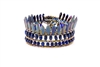 From Ziio's Mistinquett Collection, this hand-crafted bracelet has double rows of Lapis Gemstones  complimented by a fan like effect of Blue Bohemian Glass Beads and accented by Murano Glass Beads. 925 Sterling Silver Button Closure. Adjustable length.