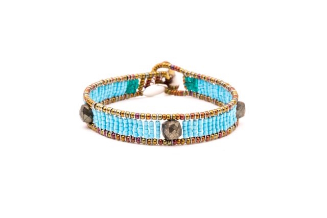 Ziio's Ovale Tennis Bracelet has imitation Turquoise Beads & Pyrite. Hand-crafted in Italy. Made with Stainless Steel wire & multi-colored Murano Glass Beads. 925 Sterling Silver Button Closure, adjustable in length. Beautiful and fun, alone or stacked.