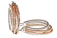 These are beautiful designer Diamond Hoop Earrings with an Italian twist on a classic style.  Made in two-tone, 18k White & Rose Gold, with multi dimensional intertwined hoops filled with 1.45ctw White Pave Diamonds. Made in Italyy by LuxGioielli