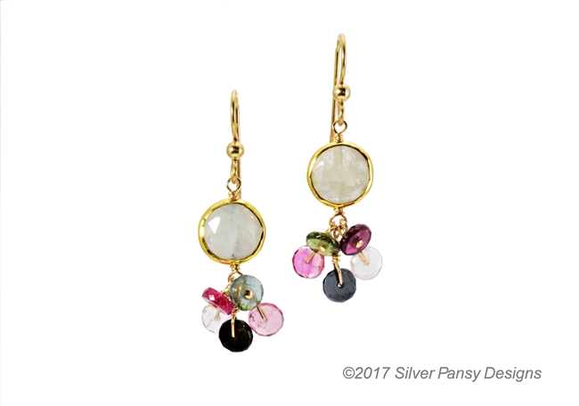 A single Moonstone Gemstone is Bezel set and holds a cluster of multi-color Heishi cut Tourmaline Gemstones. Light weight, fun, colorful & easy to wear drop Earrings.   Gold Filled Sterling Hooks and chain. Made in the U.S. by Silver Pansy. Length 1 1/2"