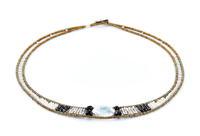 Baroque by Ziio has a single, large Baroque Pearl framed  by Black Onyx. The band is filled with White Fresh Water Pearls, Tourmaline & Murano Glass Beads. 925 Sterling Silver Button Closure. Adjustable in length from 18" to 16." Hand crafted in Italy