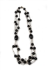 A beautiful, long, Black Onyx Bead Necklace in Rose Gold plated 925 Sterling Silver. Three strands of round Onyx Beads (aprox. 12mm) on an open link chain are connected on both sides by a large cylindrical Black Onyx Bead (aprox 1 1/4" L). Length 28"