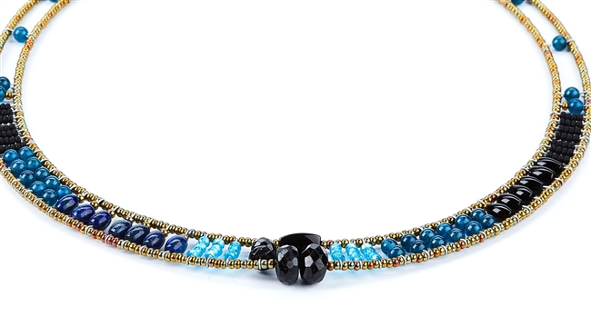 Ziio's thin Giro Necklace in various hues of Blue Gemstones - Lapis, Iolite, Blue Zircon & Black Tourmaline. A great beaded piece to add a subtle touch of color. Hand crafted in Italy on Stainless Steel wire with Murano Glass Seed Beads