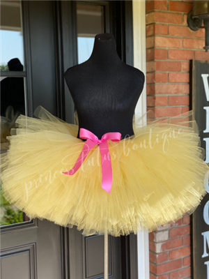 Yellow tutu with shocking pink bow