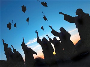 8830 GD Grads throw caps in air