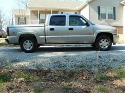 N-Fab's Stainless Steel Wheel-to-Wheel Nerf Steps for '04-'06 Chevy C1500 Crew Cab 5.5' Bed