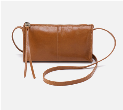Women's small tan leather top zip crossbody bag.