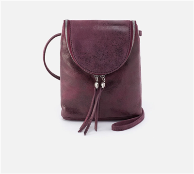 Plum buffed hide crossbody handbag with zipper closure and adjustable strap.