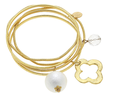 5 gold bangles with pearl and clover