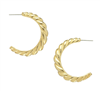 Women's gold hoop earrings.