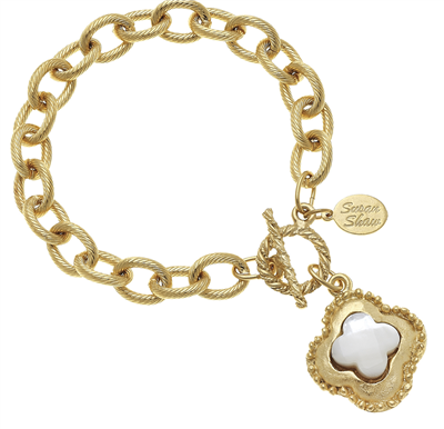 women's gold chain bracelet with gold and mother of pearl charm.