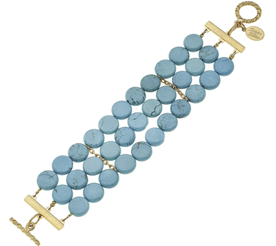 Women's triple strand 8 inch turquoise bracelet with gold toggle closure.