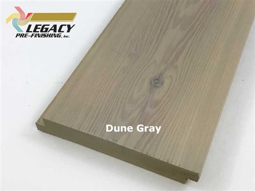 Cedar exterior shiplap siding with a smooth face prefinished in a gray/tan color called dune gray