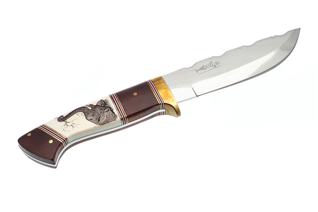 Mackrill Large Hunting Knife with a Red Ivory Wood and Scrimshawed Hippo Tooth Handle. Scrimshaw depicting an elephant with his trunk up gasping a leaf.