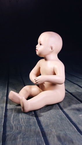 Seated toddler mannequin. Unisex toddler with realistic facial features.