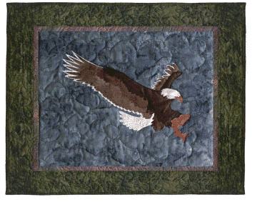 Quilt block of an eagle catching a trout