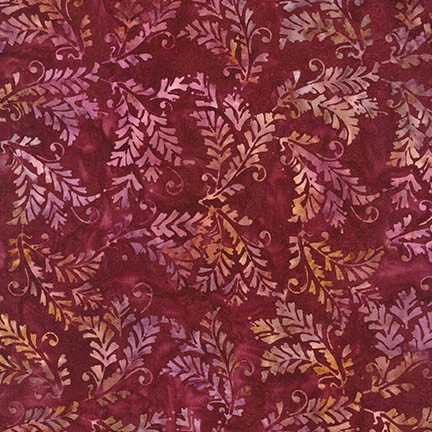 Ornate leaf batik fabric in red, wine purple, and gold.