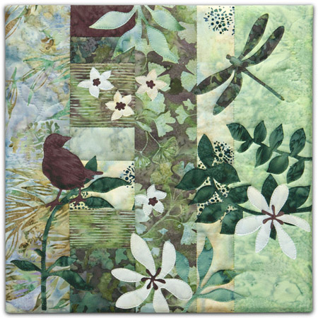 Quilt block with stylized bird on a tree branch and dragonfly in blue and green floral patterns