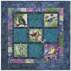 Pieced quilt block with appliqued nocturnal birds