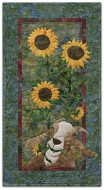 Quilt block of a goat eating sunflowers.