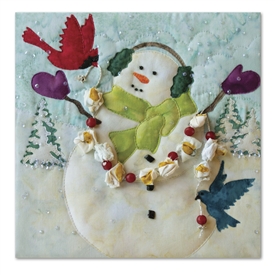 Quilt block of a snowman celebrating snowfall with two bird friends and a popcorn and cranberry garland