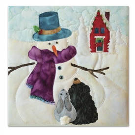 Quilt block of a snowman telling a riveting tale to a bunny and a bear cub, with a schoolhouse decorated for the holidays visible in the background