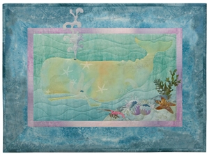 Quilt block of a frolicking sperm whale and group anemones, a starfish, and a little crab.