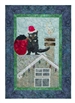 Quilt block of a Tasmanian Devil dressed as Santa on a roof with a sack of coal.