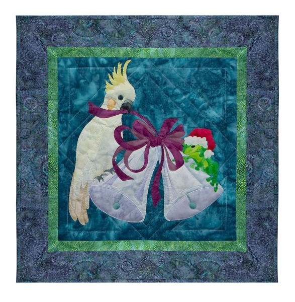 Quilt block of a cockatiel and a frog ringing in the season with a pair of bells.