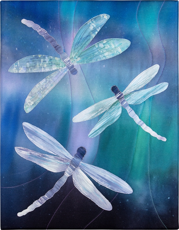 Three Dragonflies Dragonfly fluttering against a blue-green boreal background