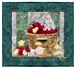 Quilt block showing a kitten watching over some new chicks, while perched on a bushel of apples.