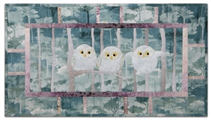 Quilt block of a trio of owlets trying out their wings for the first time