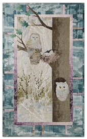 Quilt block of an owl dozing near her nest, while another owl peeks out of a hollow in the same tree