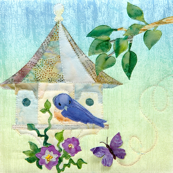 a fabric panel with a birdhouse and a bluebird