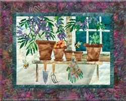 Quilt block of a potting bench with tools, and the bees attracted by the potted wisteria.