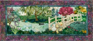 Quilt block of Mama Duck leading her family over the bridge to get to the pond.