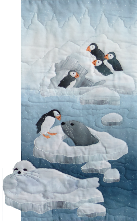 a single block quilt with an arctic snowy scene, ice floes with seals hanging and puffins