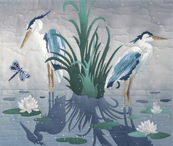 Two blue herons standing in a pond, surrounded by lily pads and a dragonfly. Laser Kit.